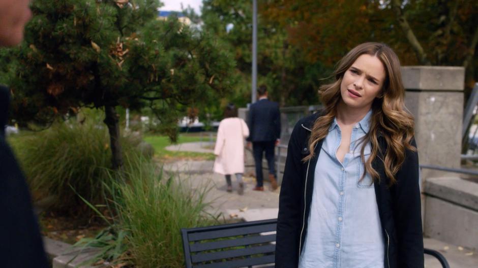 Caitlin stops and turns around as her father tries to reassure her that her mother loves her.
