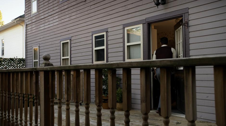 Ben Lockwood walks into his home through the back door.