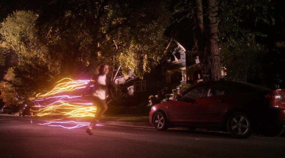 Nora races off down the street with a smile on her face.