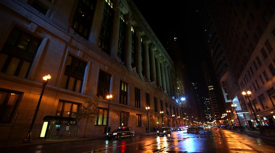 Establishing shot of the front of the police station with several GCPD cars out front.