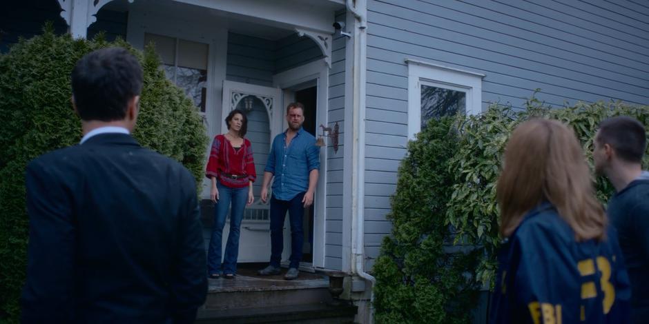 Grant, Marcy, and Trevor turn to see Kat and David standing outside the back door.