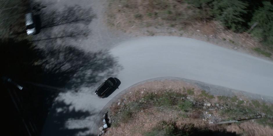 Grant drives his car around the corner towards the beach.