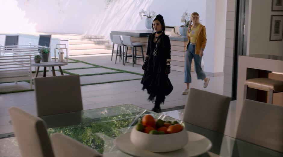 Nico and Karolina walk in to the house through the back wall.