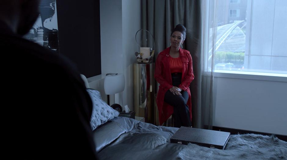 Darius enters the bedroom where Catherine is waiting patiently for him.
