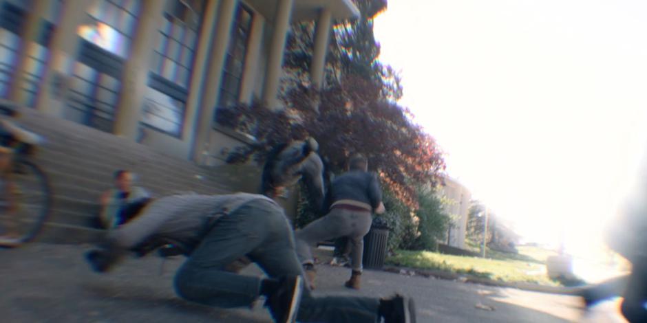 A blurry view of Trevor and Philip fighting off all four gang members.