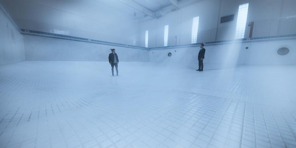 Hall turns around and sees Grant standing behind him in the ethereal pool.