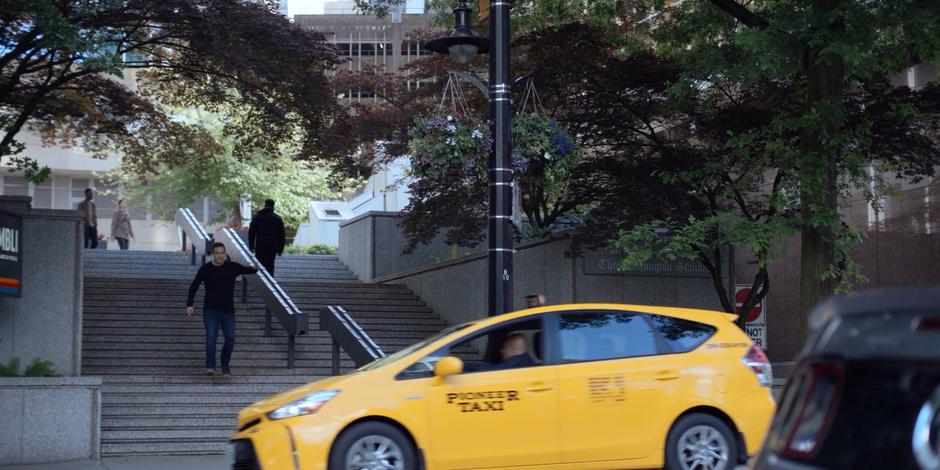 Philip runs down the stairs and tries to catch a taxi.