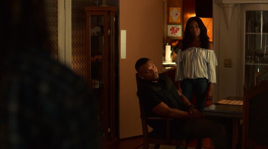 AWOL and Tamar look at Alex and Livvie as the enter the house.