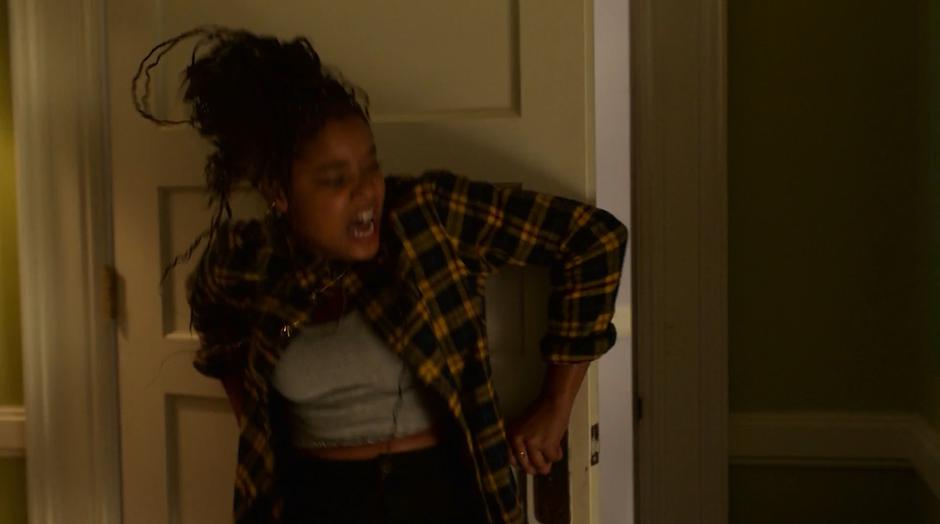 Livvie tries to block the bedroom door with her body.