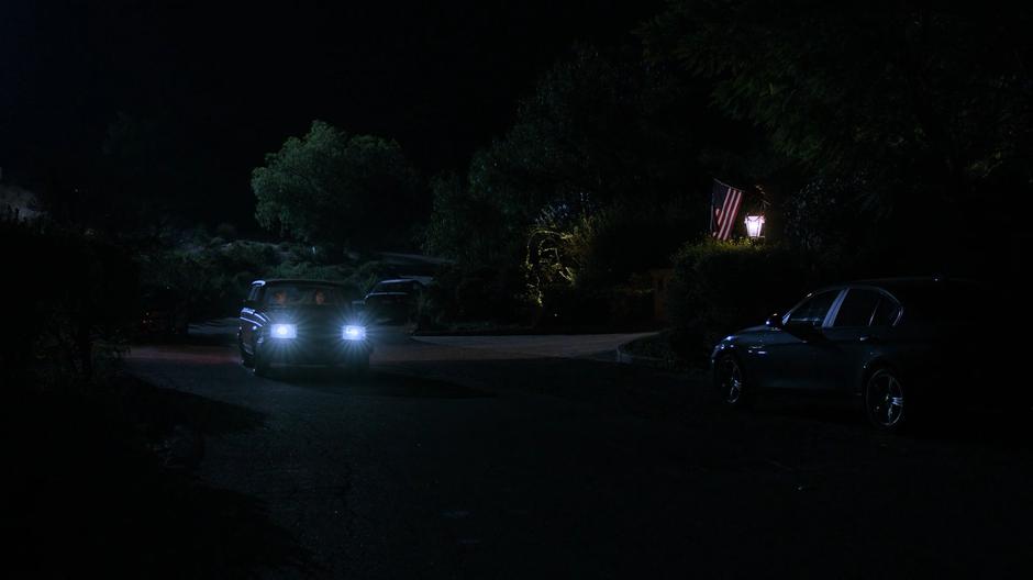 Karolina and Gert head down the driveway in the dark.