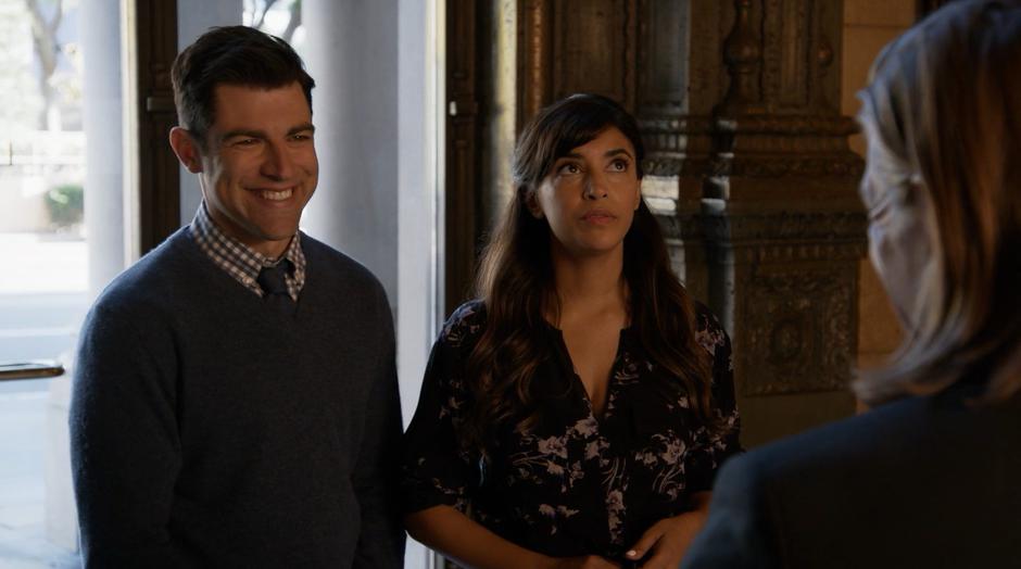 Schmidt smiles at Philip while Cece looks around the beautiful lobby.