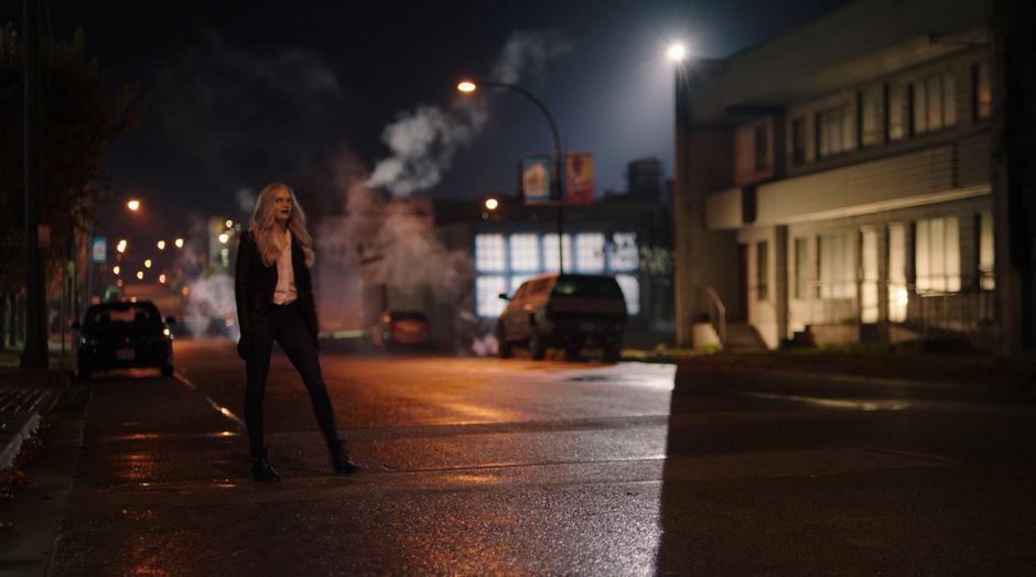 Killer Frost steps out into the street to check out her ice wall.