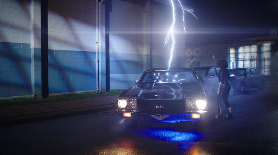 Nora runs up to the stealth car as a lightning bolt zaps the two woman inside to safety.