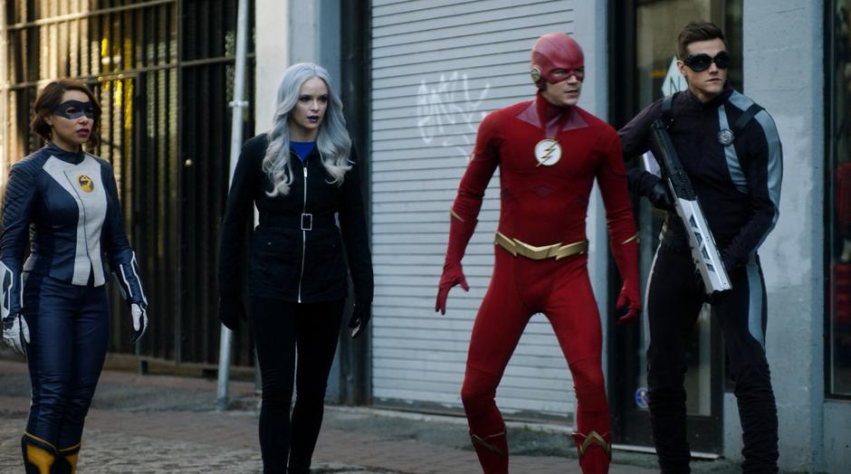 Nora, Killer Frost, Barry, and Ralph stand in a line facing against Cicada.