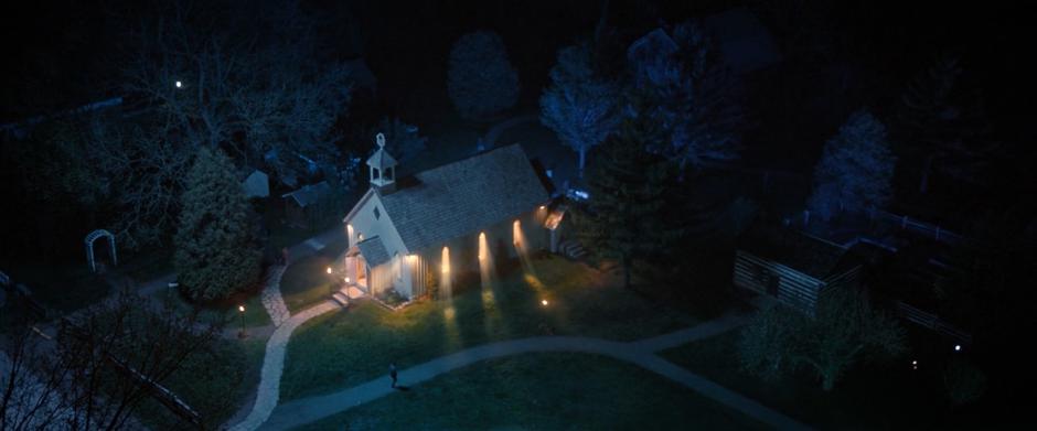 Lights shine out of the church as the electricity is restored.