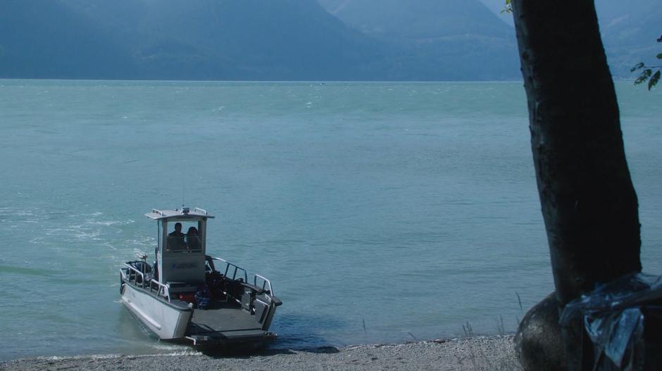 Ben and Maddie drive the boat onto the beach.