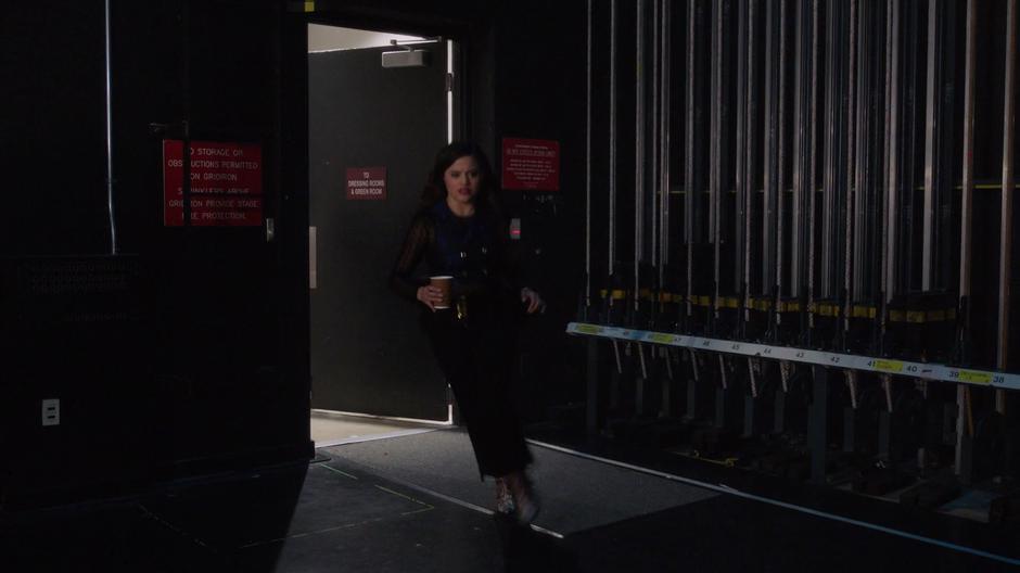 Maggie runs in from the dressing rooms with a cup of tea for Galvin.