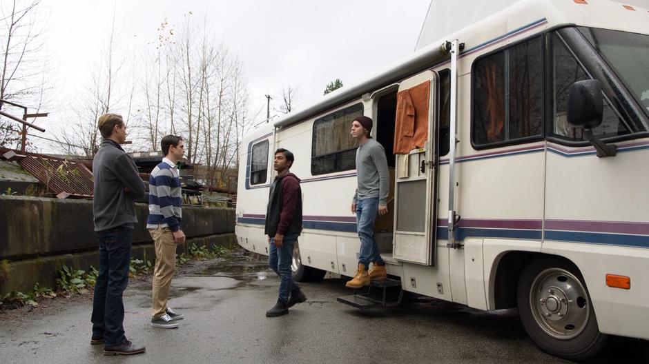 Jerry and Kevin step out of the camper to sell drugs to two frat guys.
