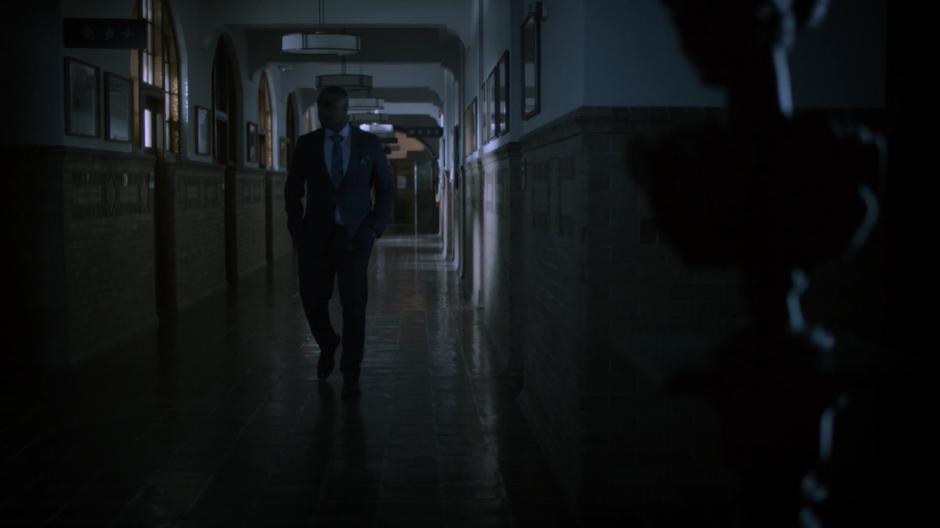 Dean Fogg walks down the hallway at night.