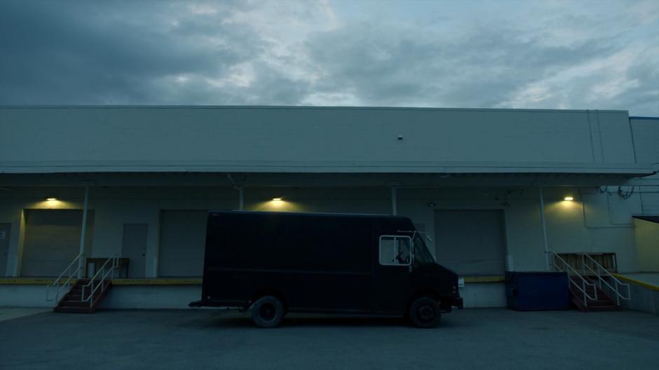 Frankie's van sits in a loading dock.
