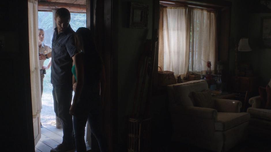 Ben turns around and tells Ryn to go back inside trying to stop Deputy Staub from getting a good look into the cabin.