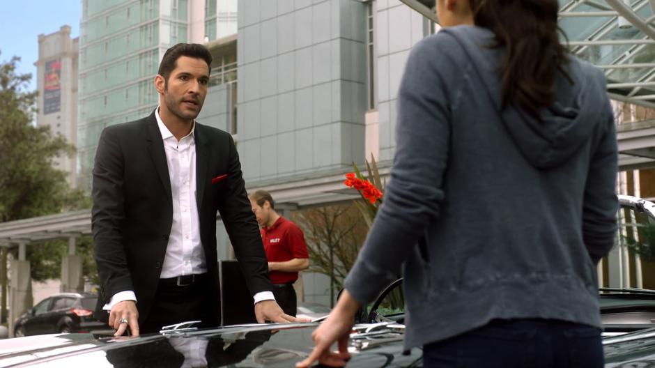 Lucifer tells Ella about Louie Pagliani while they stand beside his car.