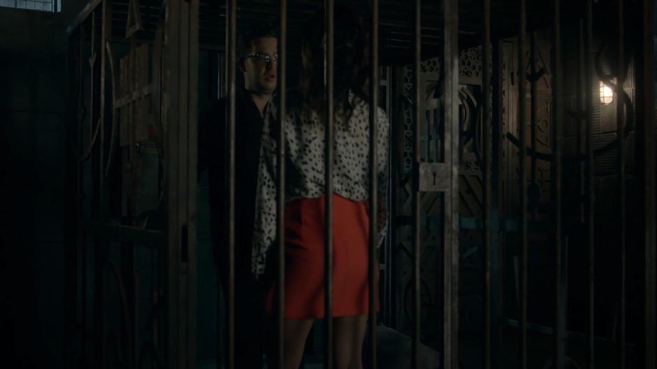 Josh backs up as Margo closes herself in the cell with him.