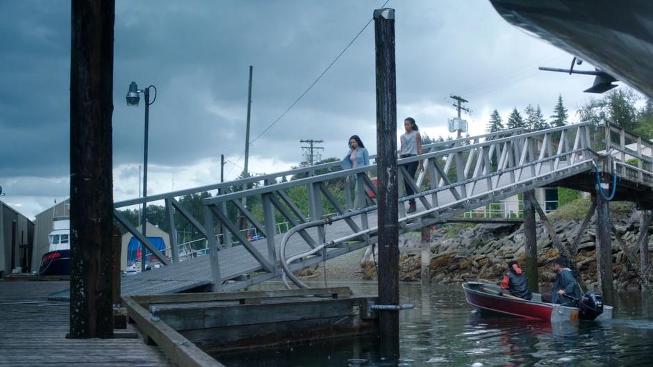 Ryn and Maddie walk down the ramp to the docks.