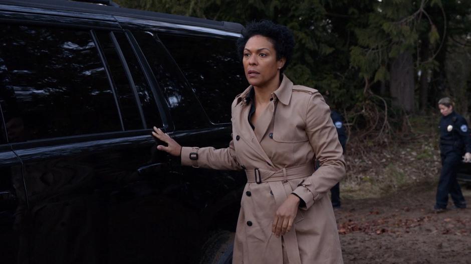 Colonel Haley greets Alex while closing the door of her SUV.