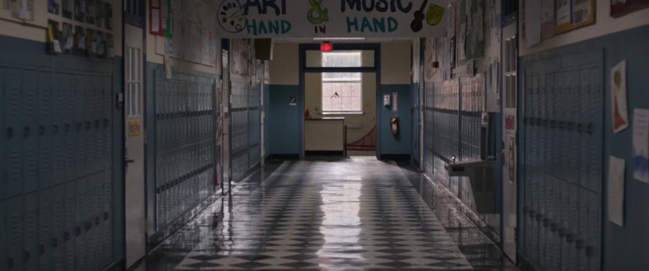 Hope and Scott fly through the school hallway.