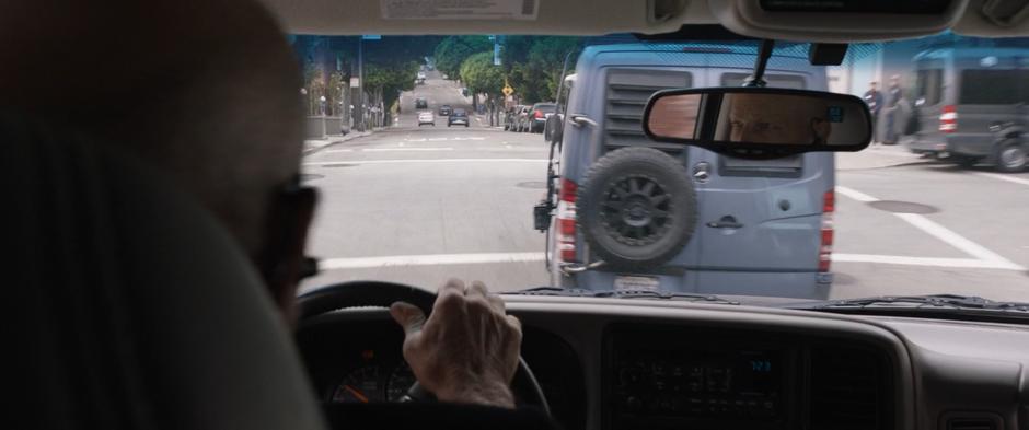 A pursuing SUV pulls up behind Hope's van.