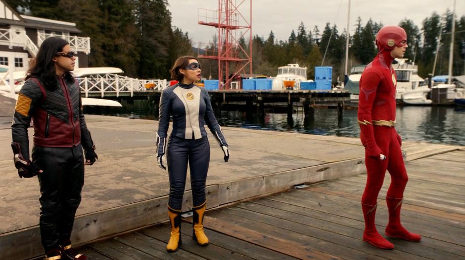 Cisco, Nora, and Barry look out over the water after King Shark fell into the water.