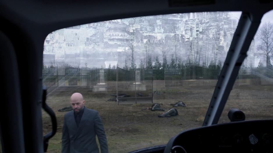 Lex walks towards the helicopter as the mansion is hidden by holographic projectors behind him.