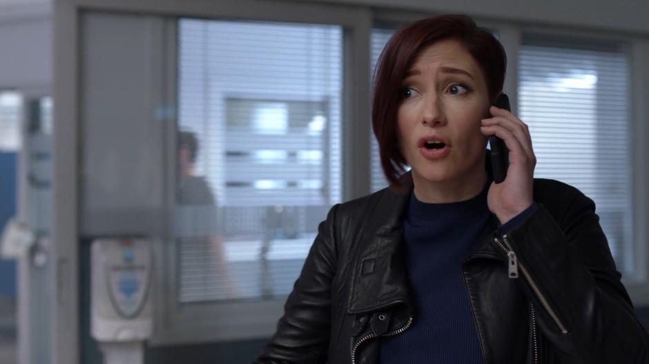 Alex talks to Kara on the phone and asks why she isn't at the hospital.