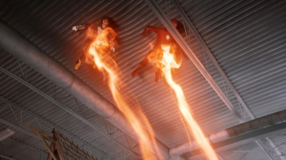 Nora and Barry are thrown up against the ceiling of building by Grace's energy beams.