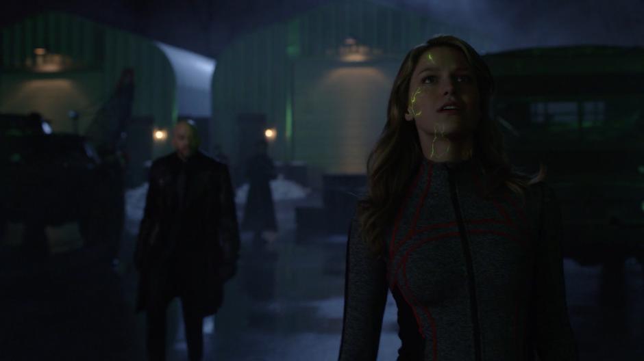 Lex walks over to Snowbird as veins of kryptonite appear in her skin.