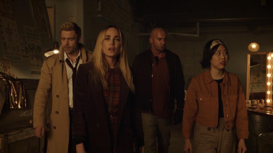 Constantine, Sara, Mick, and Mona look around the busy arena for any signs of Konane.