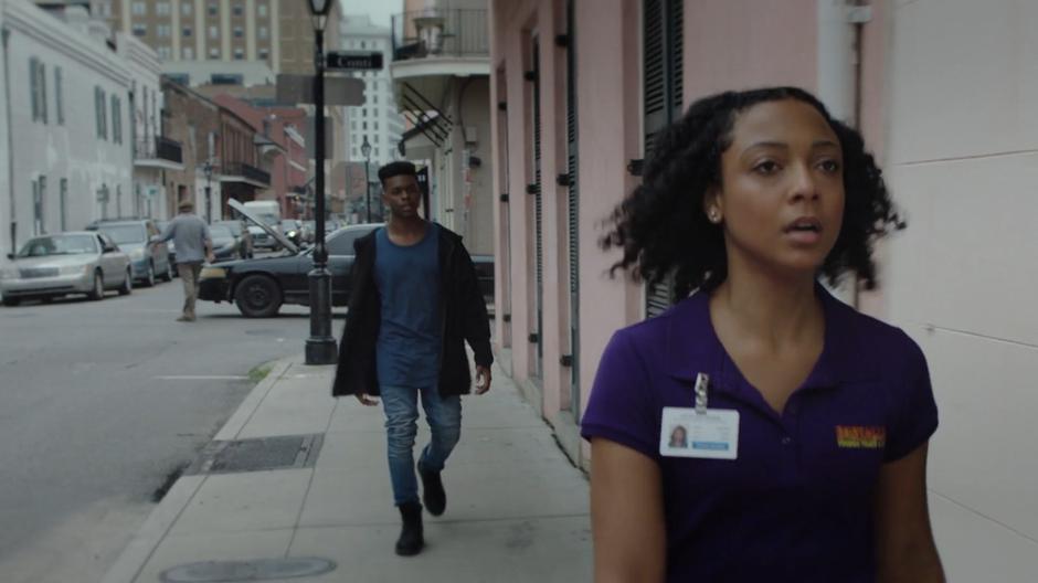 Tyrone calls out Evita's name as she walks away from him down the street.
