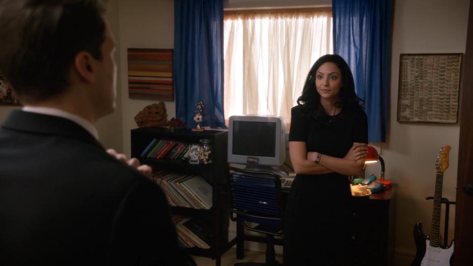 Zari stands in Nate's old room while he prepares for the memorial.