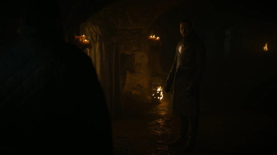 Jon turns to Sam as he comes up to him in the crypt.