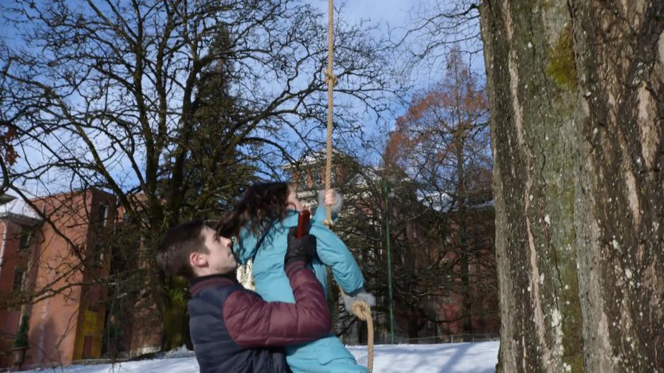 Lex helps Lena climb the rope leading up to their treehouse.