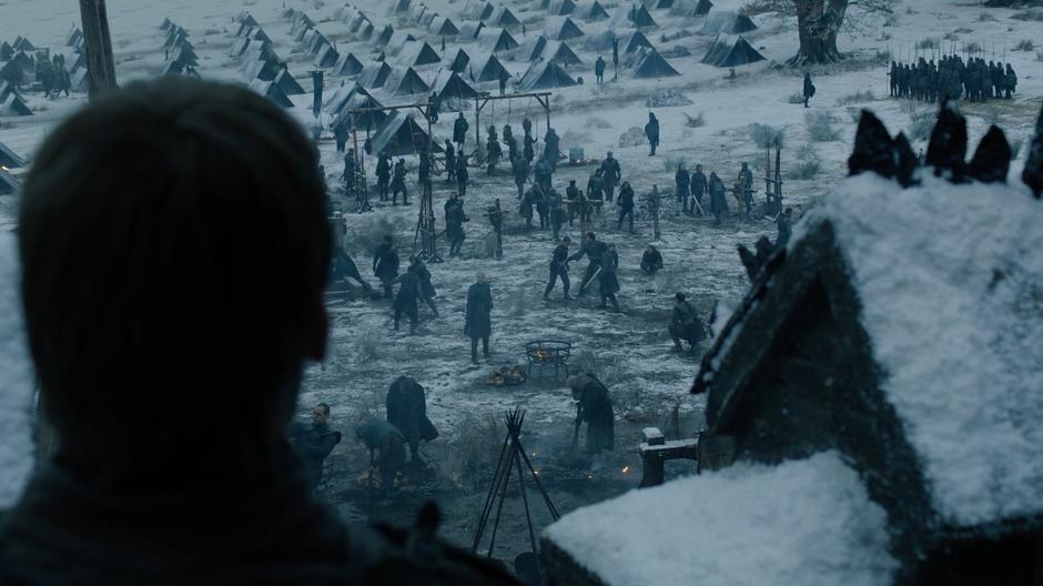 Jaime watches Brienne training Pod from the wall of the castle.