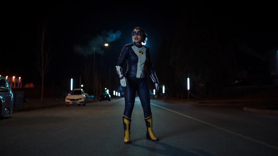 Nora stands in the street after her experiment and asks Thawne why it didn't work.