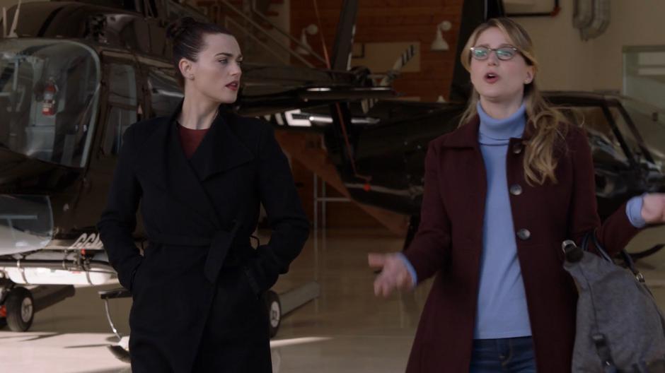 Kara tries to convince Lena that it would be better if she flew to Kasnia alone while they walk out towards the plane.