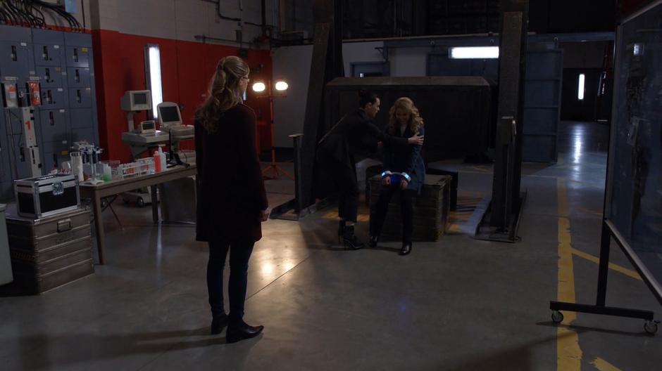 Kara watches Lena as she checks on Eve who is acting very strangely.