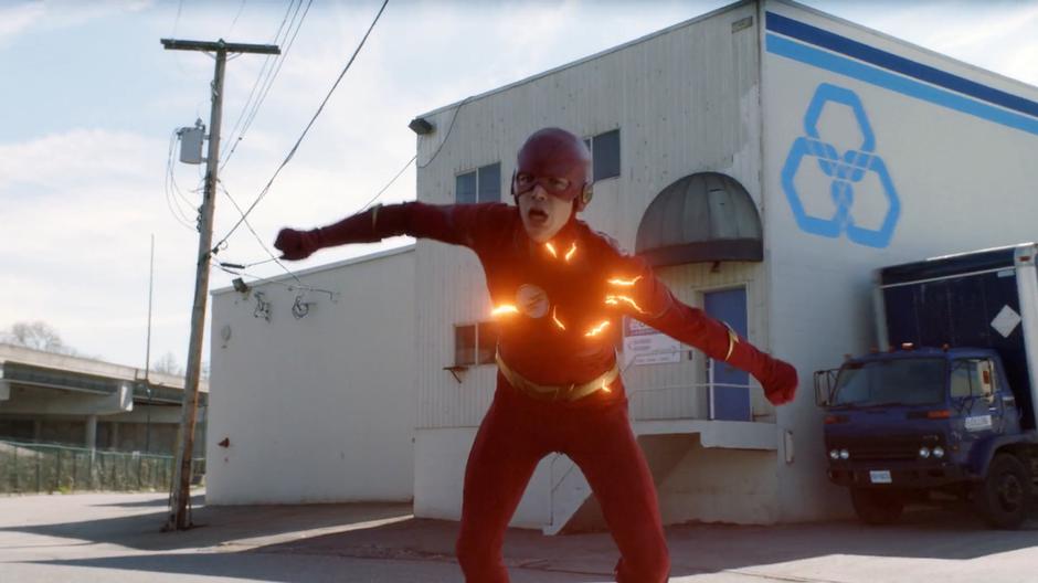 Barry races out of the lab as it explodes.