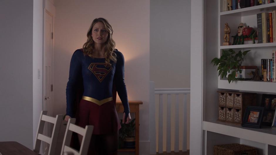 Kara calls out to her mother while searching the house.
