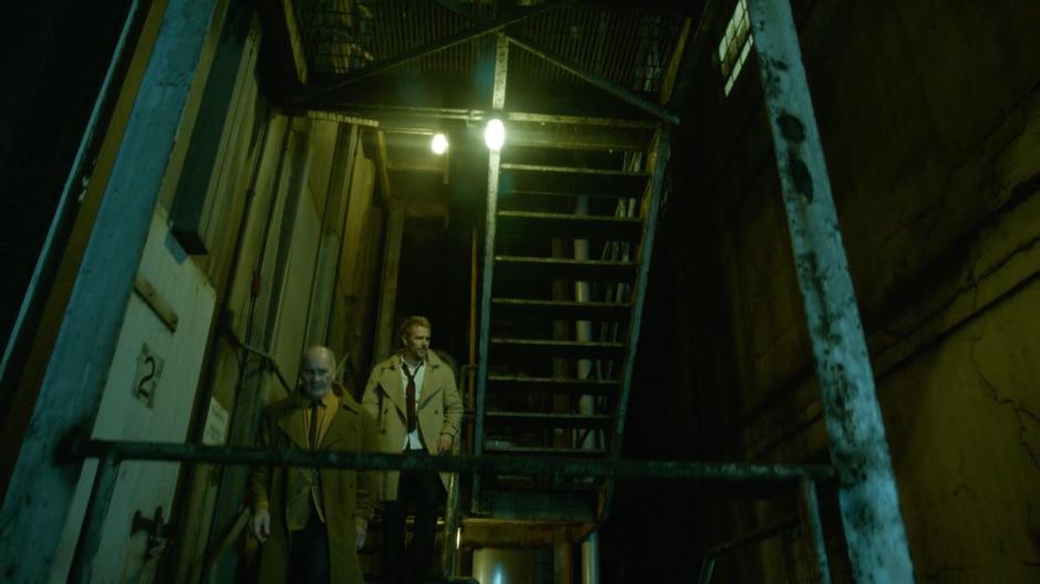 Constantine follows a demon down the stairs to pick up Astra's soul.