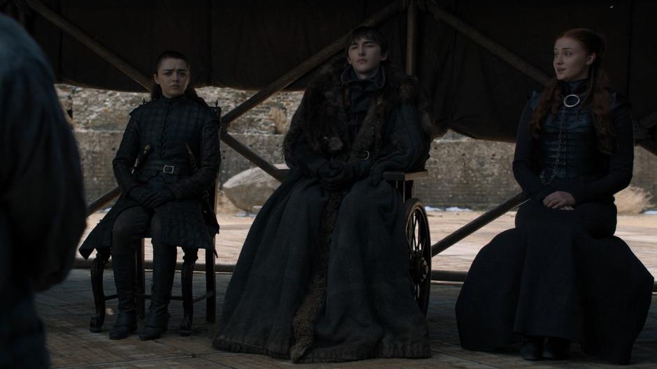 Arya and Bran listen while Sansa reponds to the proposal to make Bran the king.