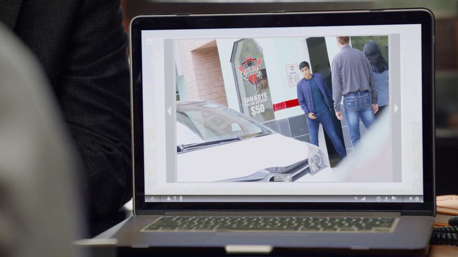 Graham Moss is seen leaving a tanning salon in a photograph on Principal Mosely's laptop.